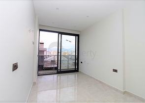 Квартира 1+1 на первой линии в Махмутлар