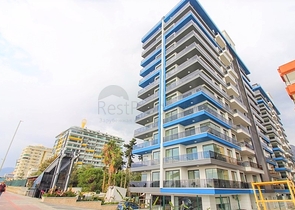 Квартира 1+1 на первой линии в Махмутлар