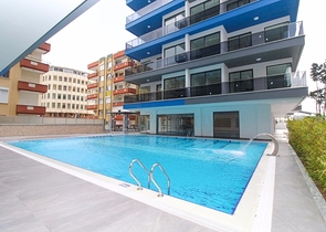 Квартира 1+1 на первой линии в Махмутлар