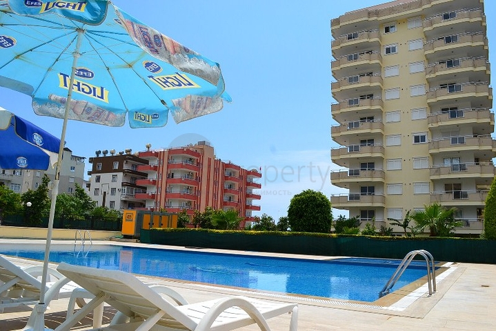 Квартира 2+1 на первой береговой линии в Махмутларе 