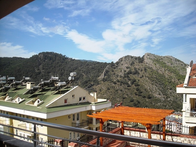 Новые апартаменты на продажу с 2-мя спальнями в центре Фетхие/Ташьяка