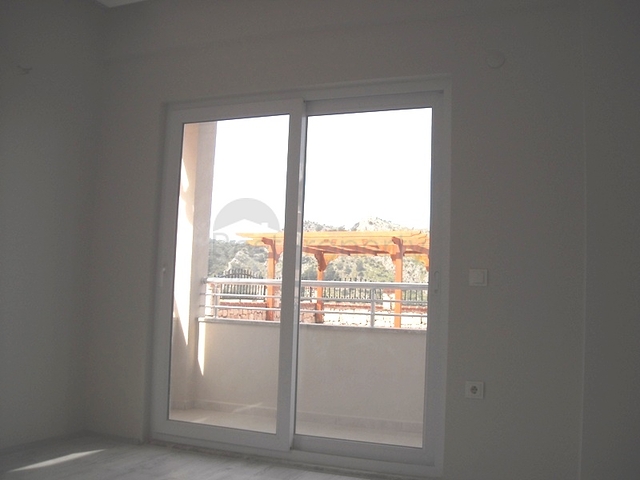 Новые апартаменты на продажу с 2-мя спальнями в центре Фетхие/Ташьяка