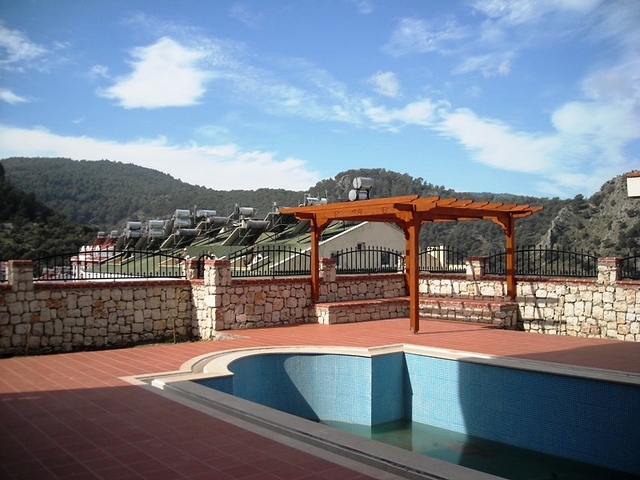 Новые апартаменты на продажу с 2-мя спальнями в центре Фетхие/Ташьяка