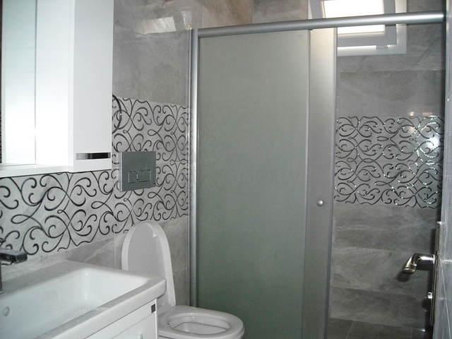 Новые апартаменты на продажу с 2-мя спальнями в центре Фетхие/Ташьяка