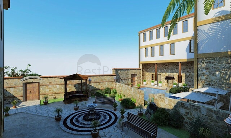 Земля с проектом отеля в Калеичи в Анталии