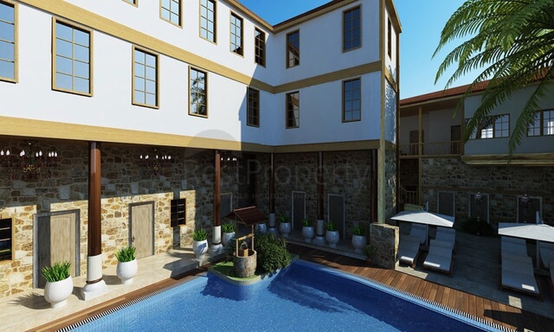 Земля с проектом отеля в Калеичи в Анталии