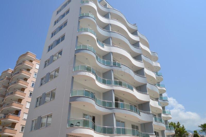 Новая двухкомнатная квартира в Махмутларе.