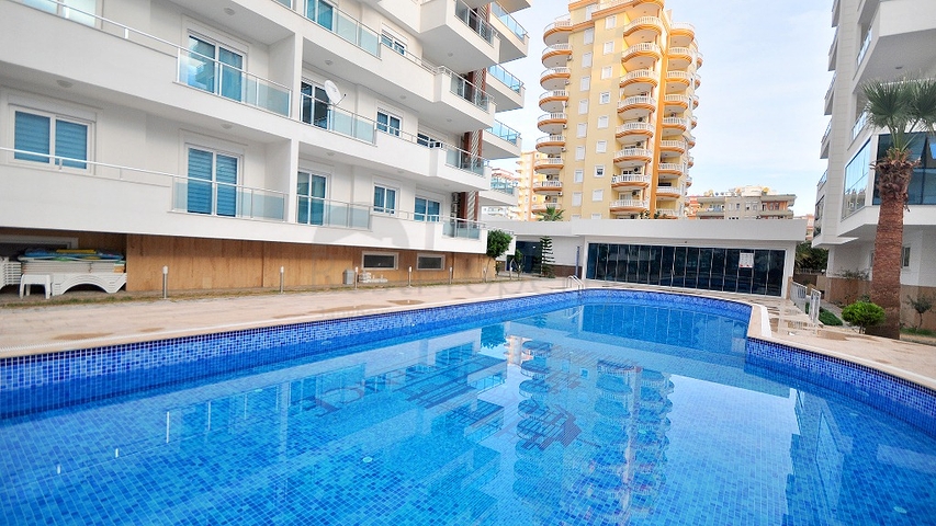 Светлые апартаменты 2+1 в Махмутларе 