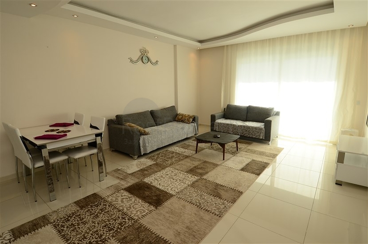 Светлые апартаменты 2+1 в Махмутларе 