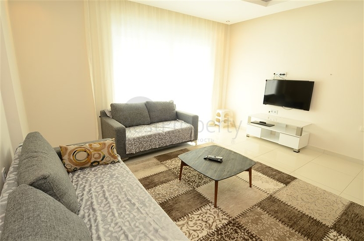 Светлые апартаменты 2+1 в Махмутларе 