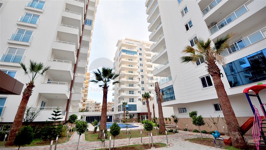 Светлые апартаменты 2+1 в Махмутларе 