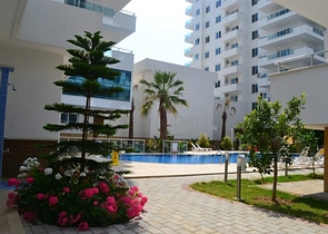 Светлые апартаменты 2+1 в Махмутларе 