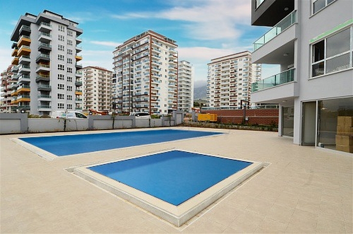 Двухкомнатные апартаменты в новом комплексе в Махмутларе