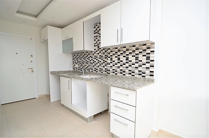 Квартира-студия в современном комплексе в Авсалларе