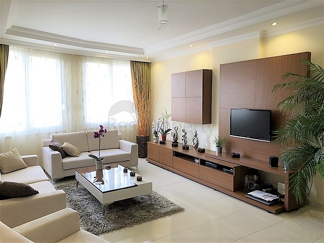 Меблированные апартаменты на первой линии в Махмутларе