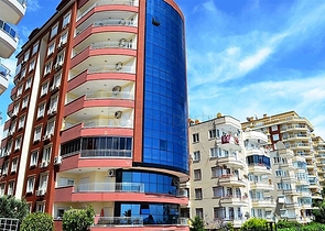 Меблированные апартаменты на первой линии в Махмутларе