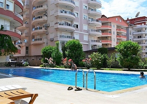 Меблированные апартаменты на первой линии в Махмутларе