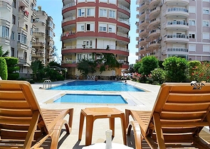 Меблированные апартаменты на первой линии в Махмутларе