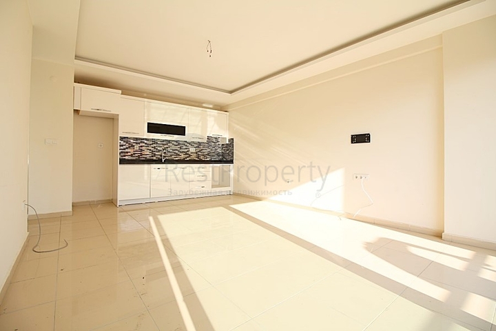 Двухкомнатная квартира в районе Махмутлар