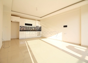 Двухкомнатная квартира в районе Махмутлар