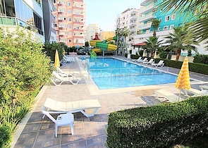 Двухкомнатная квартира в районе Махмутлар