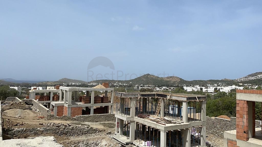 Строится комфортная вилла - проект в семейном районе Бодрума!