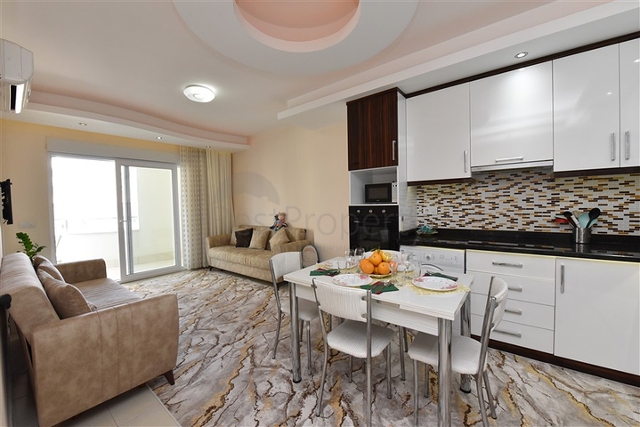 Меблированная квартира планировки 1+1 в районе Махмутлар