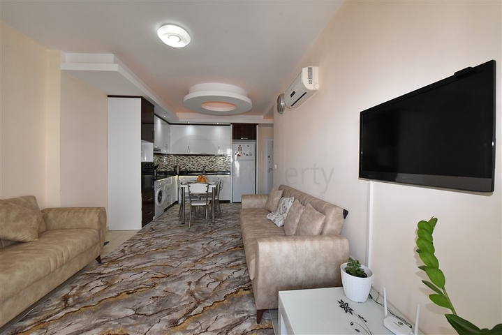 Меблированная квартира планировки 1+1 в районе Махмутлар