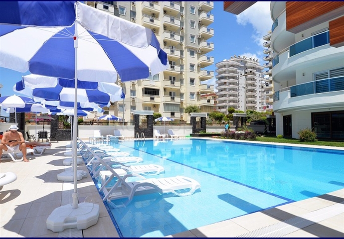 Меблированная квартира планировки 1+1 в районе Махмутлар