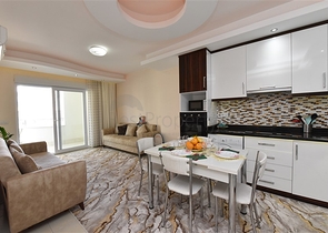 Меблированная квартира планировки 1+1 в районе Махмутлар