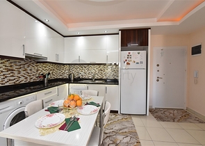 Меблированная квартира планировки 1+1 в районе Махмутлар