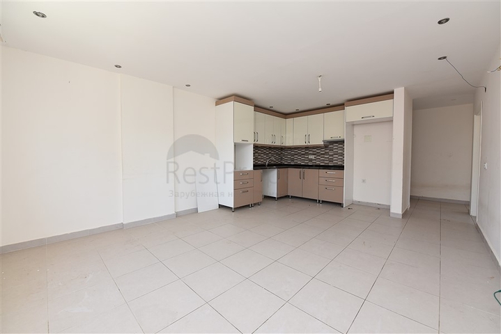 Трехкомнатная квартира в районе Махмутлар