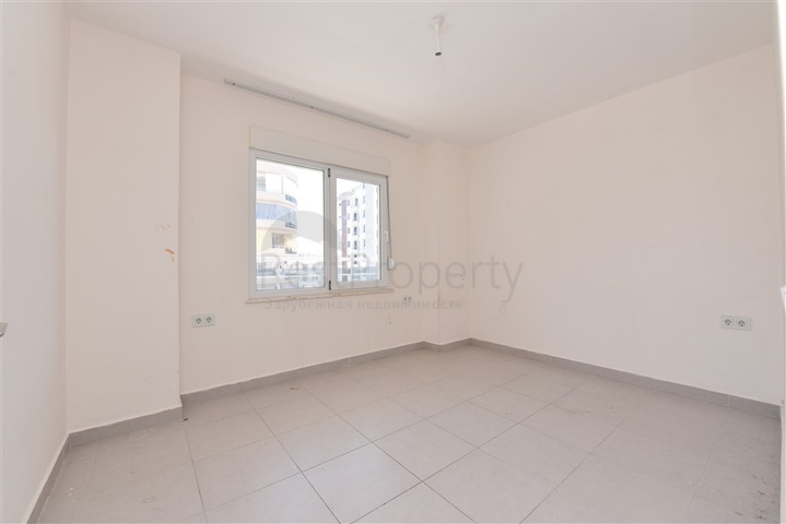 Трехкомнатная квартира в районе Махмутлар