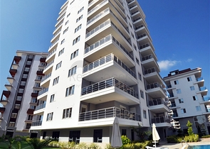 Трехкомнатная квартира в районе Махмутлар