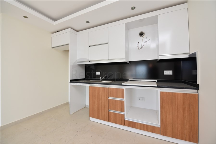 Двухкомнатная квартира в районе Махмутлар