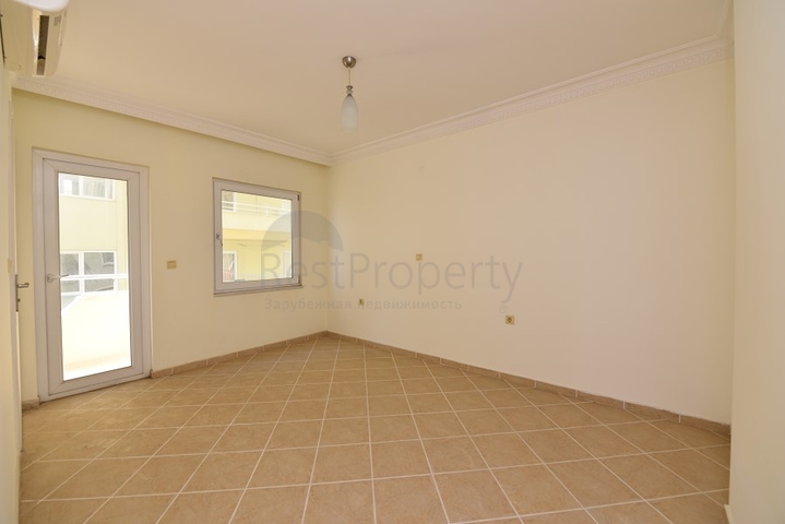 Трехкомнатная квартира в районе Махмутлар