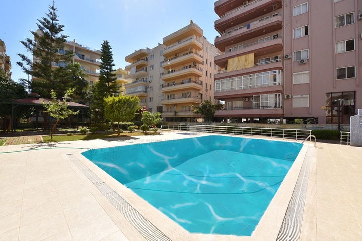 Трехкомнатная квартира в районе Махмутлар