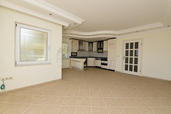 Трехкомнатная квартира в районе Махмутлар