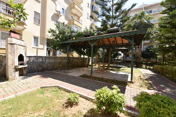 Трехкомнатная квартира в районе Махмутлар