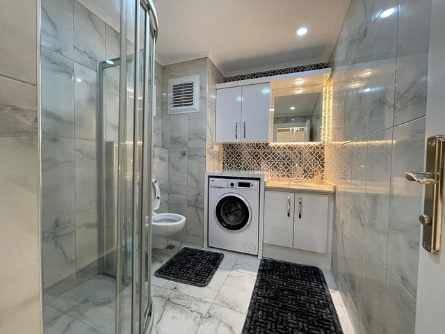 Трехкомнатная квартира в районе Махмутлар