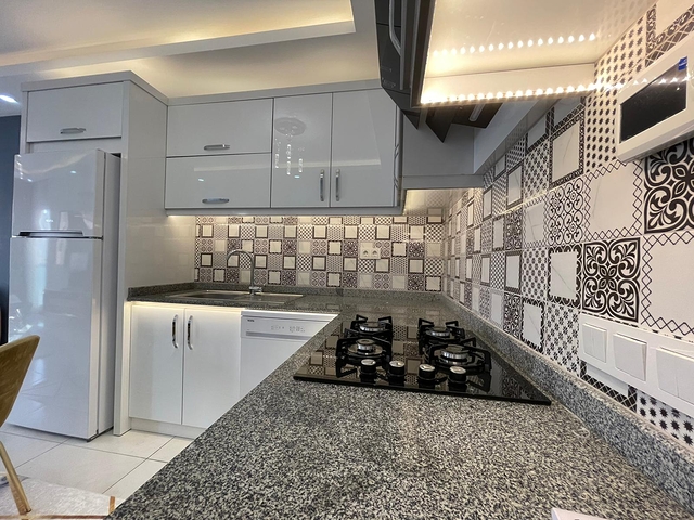 Трехкомнатная квартира в районе Махмутлар