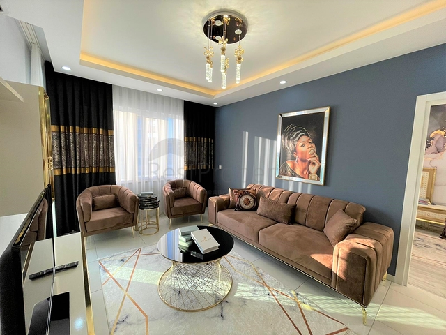 Трехкомнатная квартира в районе Махмутлар