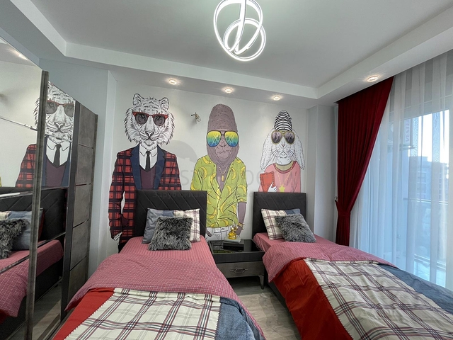 Трехкомнатная квартира в районе Махмутлар