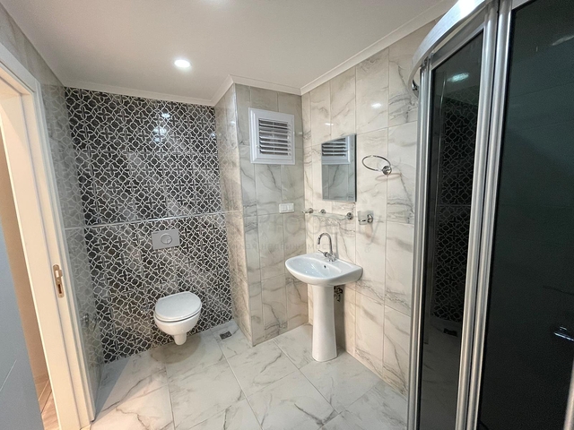 Трехкомнатная квартира в районе Махмутлар