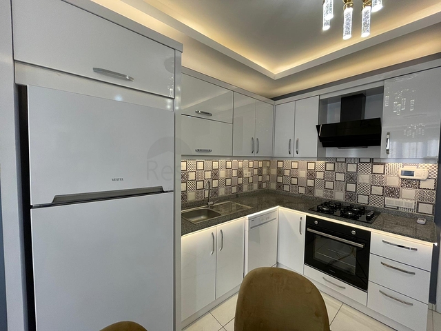 Трехкомнатная квартира в районе Махмутлар