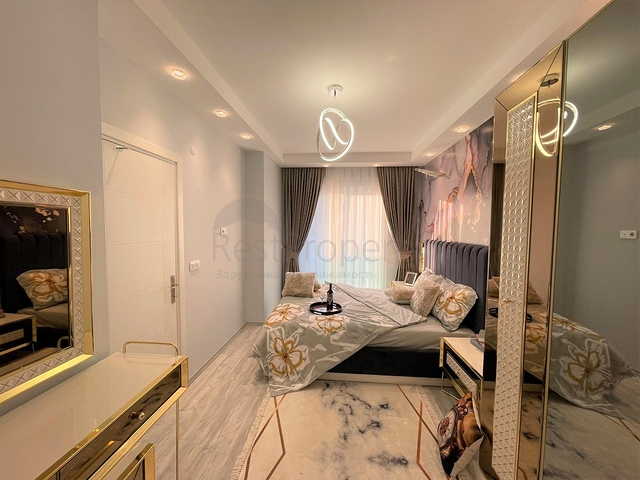 Трехкомнатная квартира в районе Махмутлар