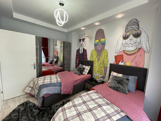 Трехкомнатная квартира в районе Махмутлар