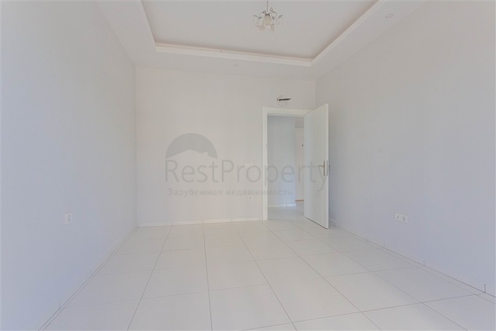 Трехкомнатная квартира в районе Махмутлар