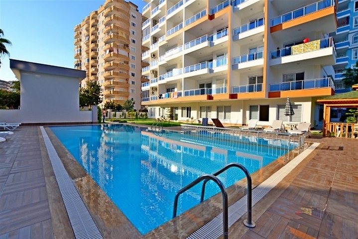 Трехкомнатная квартира в районе Махмутлар