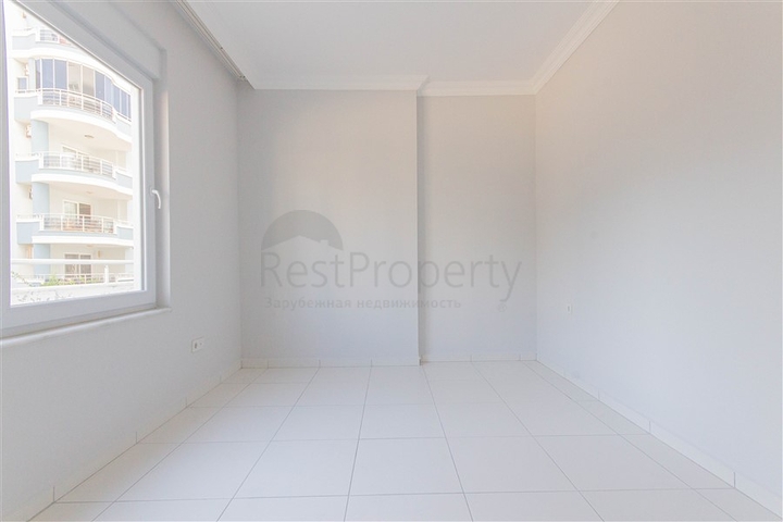 Трехкомнатная квартира в районе Махмутлар